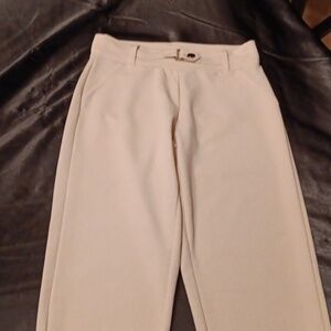 Tan dress pants. Ankle length.